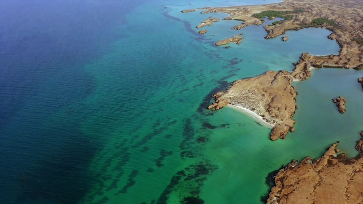 Aerial view of the coast of Farasan Island with its blue waters, aerial shot.