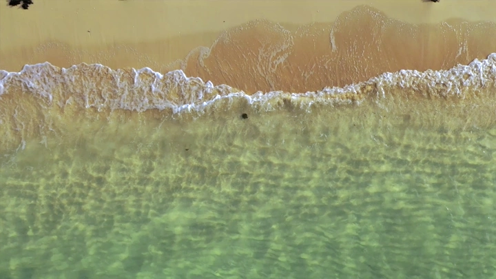 Sandy beach and clear water on Farasan Island, aerial shot.