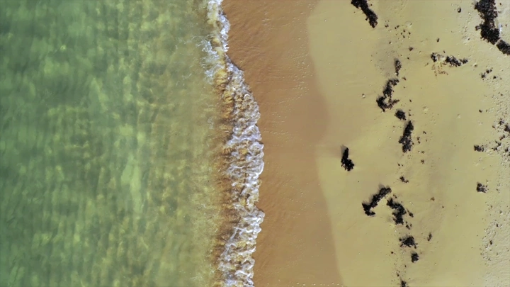 Sandy beach and blue waters in Farasan, aerial shot.