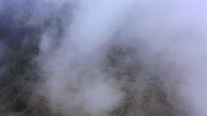 Mountains of Talan covered in fog in Jazan, aerial shot.