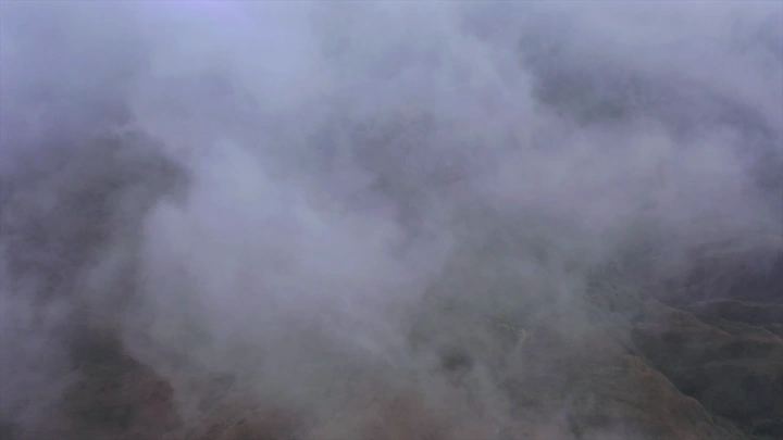 Thick fog covering Talan Mountains in Jazan, aerial shot.