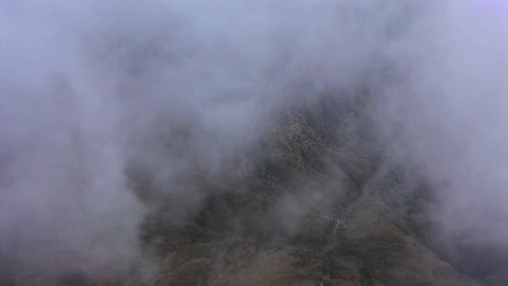 Mountains of Talan covered in fog in Jazan, aerial shot.