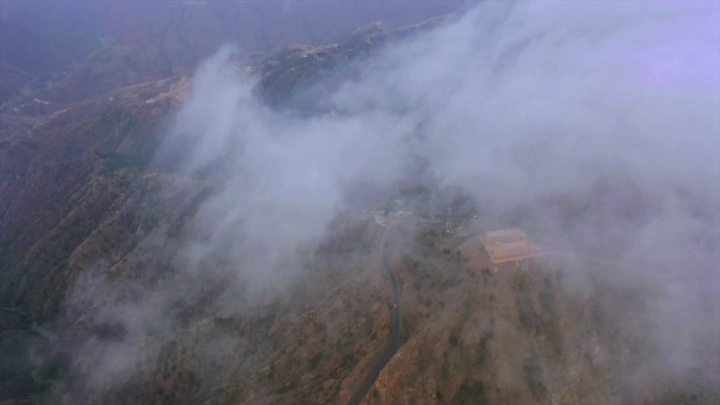 Mountains of Talan covered in fog in Jizan, aerial shot.