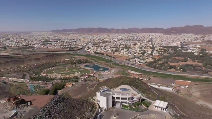 Aerial view of Al-Samra Park in Hail under a clear sky.