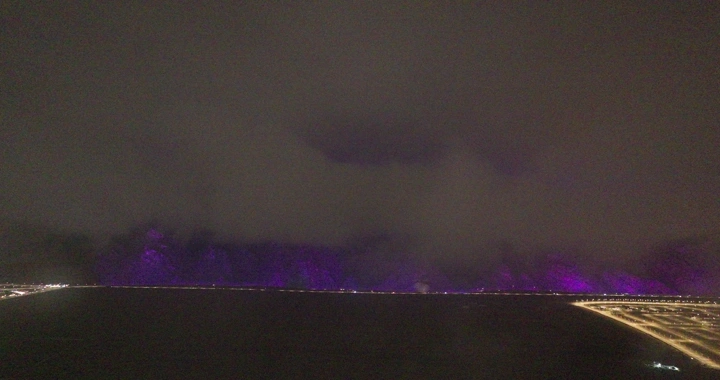 Cloudy sky over Hail at night, aerial view.