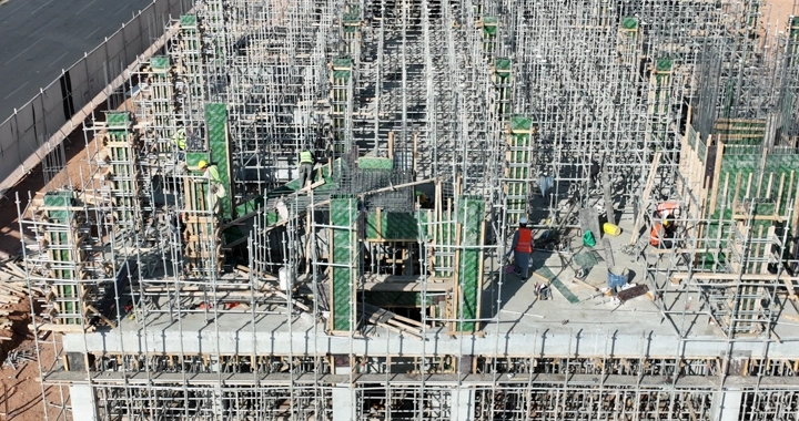 Construction workers at a building site, overhead shot.