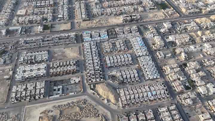 An aerial view of Al-Narjis houses in Riyadh, showing an organized urban layout.
