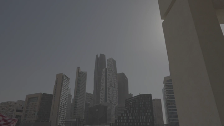 رجل ينظر إلى ناطحات سحاب في المدينة المالية بالرياض، لقطة من الأسفل.