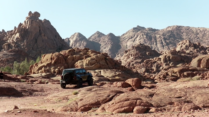 Car on rocky terrain in Hail, daytime shot.