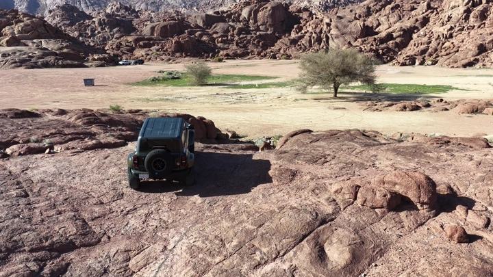 Car on a mountainous edge in Hail city, aerial shot.