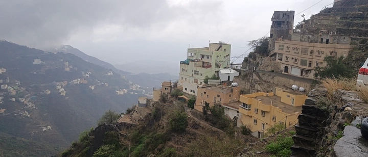 Houses on the mountains of Fayfa in Jazan under mist, daytime shot.